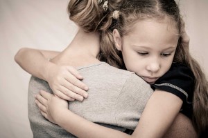 Child hugging mother