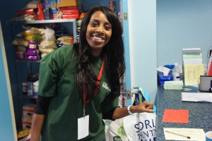 lady-volunteer-at-foodbank-centre-smiling