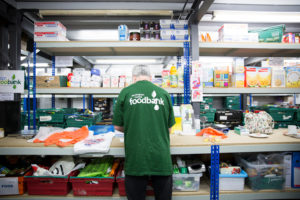 Volunteer in a food bank warehouse