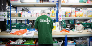 Volunteer in food bank warehouse
