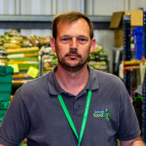 Member of food bank staff in a warehouse of the food bank