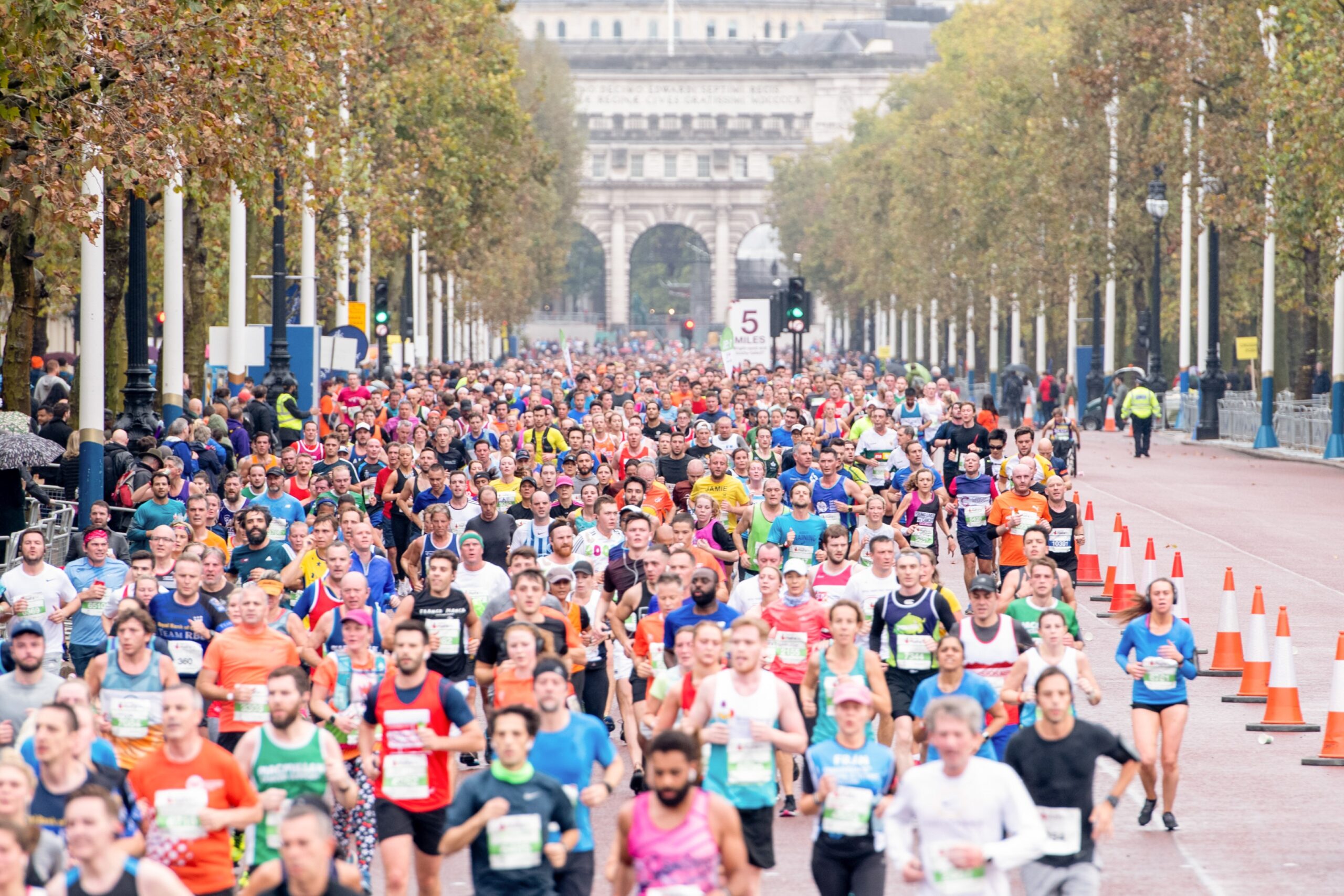 A large number of participants in the Royal Parks Half Marathon run towards the camera.